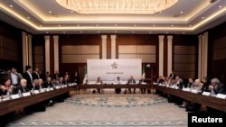 Syrian Opposition Coalition members and Syrian National Coalition members attend a meeting in Istanbul, March 18, 2013. 
