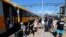 FILE - Tourists exit a train on the first direct train service from Prague to Rijeka, at the station in Rijeka, Croatia, July 1, 2020.