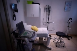 A smiley pillow sits on a gynecological table at Casa Fusa, a health center that advices women on reproductive issues and performs legal abortions, in Buenos Aires, Argentina, Friday, Jan. 22, 2021.