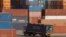 A truck ferries a shipping container at a port in the southern Indian city of Chennai, February 13, 2013.
