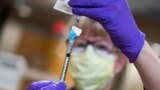 A dose of the coronavirus disease vaccine is prepared at UW Health in Madison, Wisconsin, Dec. 14, 2020. 