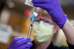 A dose of the coronavirus disease vaccine is prepared at UW Health in Madison, Wisconsin, Dec. 14, 2020. (Courtesy UW Health)