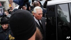 FILE - Former campaign adviser for President Donald Trump, Roger Stone, leaves federal court in Washington, Feb. 1, 2019. 