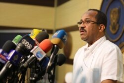 FILE - Sudanese Health Minister Akram Ali Al-Tom speaks during a press conference in Khartoum, Sudan, Friday, March. 13, 2020. Sudan reported its first case of the coronavirus , a person who had already died.