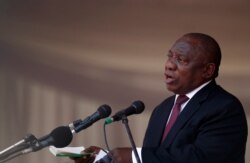 FILE - President of South Africa Cyril Ramaphosa speaks during a state funeral of Zimbabwe's longtime ruler Robert Mugabe, at the national sports stadium in Harare, Zimbabwe, Sept. 14, 2019.
