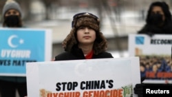Umer Jan, 12, takes part in a rally to encourage Canada and other countries to consider labeling China's treatment of its Uyghur population and Muslim minorities as genocide, outside the Canadian Embassy in Washington, D.C., Feb. 19, 2021.