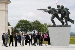 Lord Edward Llewellyn, British ambassador to France, and France's Defense Minister Florence Parly attend the official opening ceremony of the British Normandy Memorial at Ver-sur-Mer, on the 77th anniversary of D-Day, France, June 6, 2021.