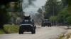 ARCHIVO - Tanques de la policía patrullan el área cercana al Palacio Nacional en Puerto Príncipe, Haití, el 28 de junio de 2024. 