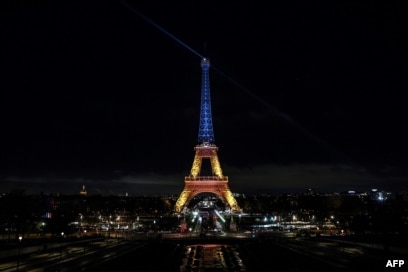 The Eiffel Tower is lit in the colors of the Ukrainian flag to mark the third anniversary of the invasion by Russia of Ukraine, in Paris, on Feb. 24, 2025.