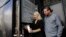 The Skysource/Skywater Alliance co-founders David Hertz, right, and his wife Laura Doss-Hertz demonstrate how the Skywater 300 turns air into water, in Los Angeles, Oct. 24, 2018. 