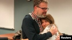 Kevin Garratt, a Canadian held in China for two years on suspicion of spying, hugs wife Julia Garratt after being deported by Chinese authorities, in Vancouver, British Columbia, Canada, Sept. 15, 2016. The family took and released the photo via Reuters.