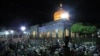 FILE - Syrian Shiites pray outside the shrine of Sayyida Zeinab in Damascus, June 28, 2016. Syria's de facto government said on Jan. 11, 2025, that it had averted a plan by the Islamic State to bomb the shrine.