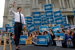 FILE - Democratic presidential candidate Pete Buttigieg waves to supporters outside the Statehouse, in Concord, Oct. 30, 2019.