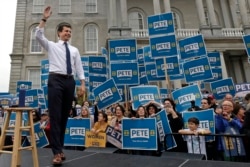 FILE - Democratic presidential candidate Pete Buttigieg waves to supporters outside the Statehouse, in Concord, Oct. 30, 2019.