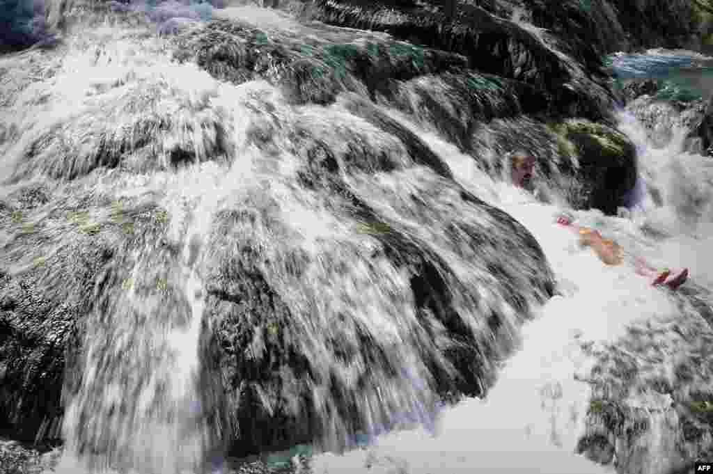 A man enjoys a bath at the hot springs of the famous Thermopylae ( &#39;the hot gates&#39;) in central Greece, Mar. 19, 2014.