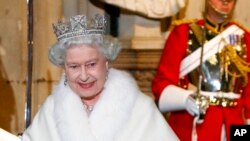 FILE - Britain's Queen Elizabeth II wears fur as she leaves the Houses of Parliament in London, where she delivered her speech for the State Opening of Parliament, Nov. 8, 2009.
