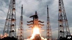 FILE - This photo released by the Indian Space Research Organization shows its Geosynchronous Satellite Launch Vehicle MkIII, carrying Chandrayaan-2, lift off from Satish Dhawan Space center in Sriharikota, India, July 22, 2019. 