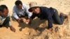 FILE PHOTO: A member of the non-profit Wildlife Conservation Society (WCS) holds a Royal turtle egg as they found at Sre Ambel in Koh Kong province, Cambodia February 3, 2018. REUTERS/WCS Cambodia Handout via Reuters 