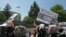 Pro-Islamic Turks, in support  of ousted Egyptian President Mohammed Morsi shout slogans including "This is the home of the murderers" as they point toward the U.S embassy during a protest in Ankara, July 5, 2013.