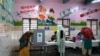 People vote at a polling station during the state assembly election in New Delhi, India, Feb. 5, 2025. 