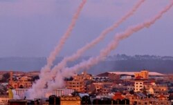 Rockets are launched toward Israel from the southern Gaza Strip, May 17, 2021.