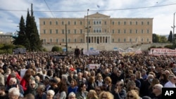 People attend a rally organised by the association of the families of victims of the Tempe, Greece, train collision, which killed 57 people almost two years ago, at central Syntagma square, in Athens, Jan. 26, 2025. 