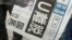 FILE - A special issue of Japan's Sankei Shimbun is handed out outside a train station in Tokyo, June 24, 2016. 