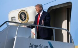 President Donald Trump exits Air Force One as he arrives at Tulsa International Airport on his way to his first re-election campaign rally in several months in the midst of the coronavirus disease (COVID-19) outbreak in Tulsa, Oklahoma, June 20, 2020