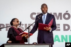 Mozambique's President-elect Daniel Chapo takes the oath of office during his inauguration ceremony in Maputo, Mozambique, Jan. 15, 2025.