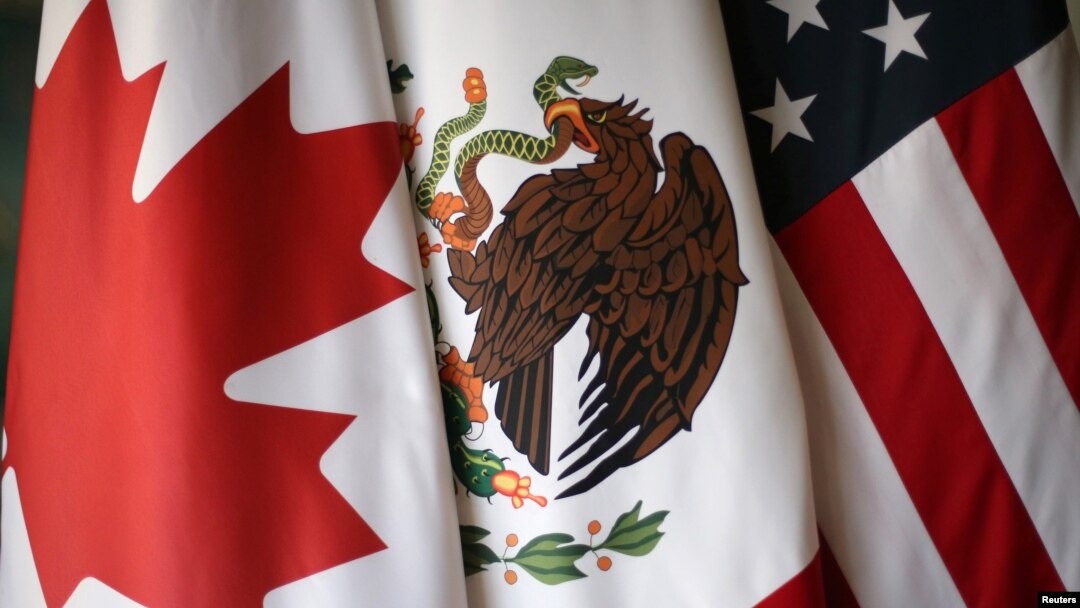 Flags are pictured during the fifth round of NAFTA talks involving the United States, Mexico and Canada, in Mexico City, Nov. 19, 2017. 