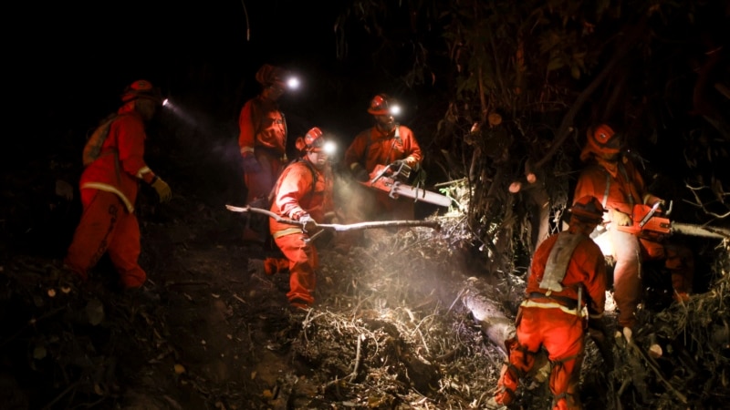 California firefighters battle wildfires as forecasters warn of dangerous winds