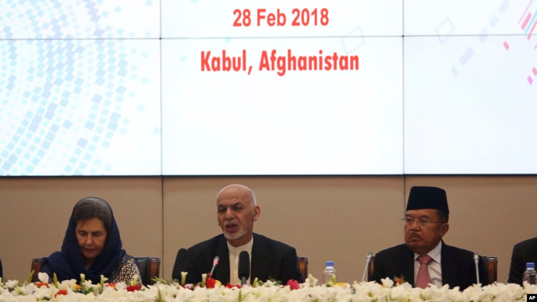FILE - In this Wednesday, Feb. 28, 2018 file photo, Afghanistan's President Ashraf Ghani, center, speaks during the 2nd Kabul Process conference at the Presidential Palace in Kabul.