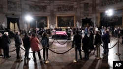 Mourners pay their respects as the flag-draped casket of former President Jimmy Carter lies in state at the U.S. Capitol, in Washington, Jan. 8, 2025. Carter died Dec. 29 at the age of 100. 