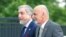 FILE - Afghanistan's President Ashraf Ghani, right, and Chief Executive Abdullah Abdullah arrive for sessions of the second day of the NATO Summit, in Warsaw, Poland, July 9, 2016.