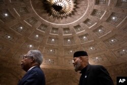 FILE - Rev. Dr. J. Wendell Mapson Jr., left, and Imam Kenneth Nuriddin exit following a commemoration service for 19 unidentified Black Philadelphians whose remains were part of a display at the University of Pennsylvania's Penn Museum on February 3, 2024, in Philadelphia.