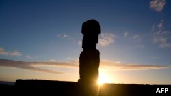 FILE - View of a Moai – stone statue of the Rapa Nui culture – on the Tahai site on Easter Island, 3700 km off the Chilean coast in the Pacific Ocean, on August 12, 2013.