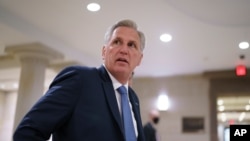 FILE - House Minority Leader Kevin McCarthy and fellow Republicans gather to consider a replacement for Rep. Liz Cheney, was ousted from Republican leadership for criticizing former President Donald Trump, at the Capitol, May 13, 2021.