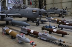 A US deal is delivering a dozen A-29 Super Tucano fighter planes, painted in camouflage, to Nigeria’s military. Shown here are A-29 Super Tucano planes handed over to the Afghan army at the military Airport in Kabul, Afghanistan, Sept. 17, 2020.