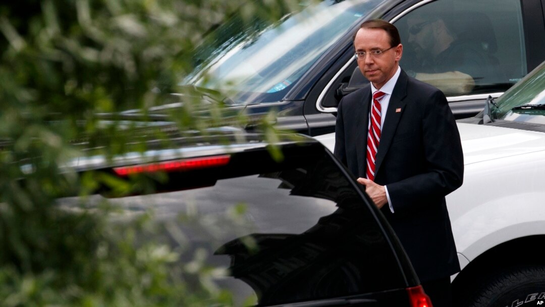 FILE - Deputy Attorney General Rod Rosenstein leaves a meeting at the White House in Washington, May 21, 2018. 