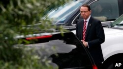 FILE - Deputy Attorney General Rod Rosenstein leaves a meeting at the White House in Washington, May 21, 2018. 