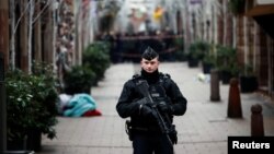 A French gendarme secures a street at the scene of a police operation the day after a shooting in Strasbourg, Dec. 12, 2018. 