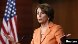 FILE - U.S. House Minority Leader Nancy Pelosi speaks to reporters.