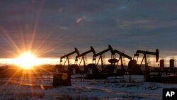 FILE —In this Jan. 14, 2015, file photo, oil pump jacks are seen in McKenzie County, in western North Dakota. The Trump administration sought to ease rules for oil and gas drilling that were adopted under the Obama administration.