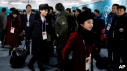 Members of the North Korean Olympic delegation arrive at the Olympic Village of the 2018 Winter Olympics in Gangneung, South Korea, Feb. 1, 2018.