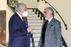 U.S. envoy for peace in Afghanistan Zalmay Khalilzad (L) talks with Abdullah Abdullah, Chairman of the High Council for National Reconciliation in Kabul, Afghanistan, Jan. 5, 2021. (High Council for National Reconciliation Press Office/Handout)
