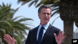 FILE - California Gov. Gavin Newsom talks during a news conference in Universal City, Calif., June 15, 2021. The governor on Feb. 17, 2022, announced the first shift by a state to an endemic approach to the coronavirus pandemic.