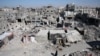 A Palestinian walks past the rubble of houses destroyed by Israeli strikes, amid Israel-Hamas conflict, in Khan Younis in the southern Gaza Strip, Sept. 4, 2024. 