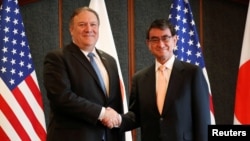 U.S. Secretary of State Mike Pompeo shakes hands with Japan's Foreign Minister Taro Kono during a bilateral meeting at a hotel in Seoul, South Korea, June 14, 2018.