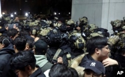 South Korean martial law soldiers try to enter the National Assembly compound in Seoul, South Korea, on Dec. 4, 2024.