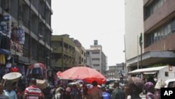 A woman woman sells plastic bags in a busy market on Lagos Island in Lagos, Nigeria. Lagos is expected to overtake Cairo soon as Africa's largest city.